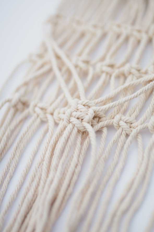 close up of macrame wall hanging