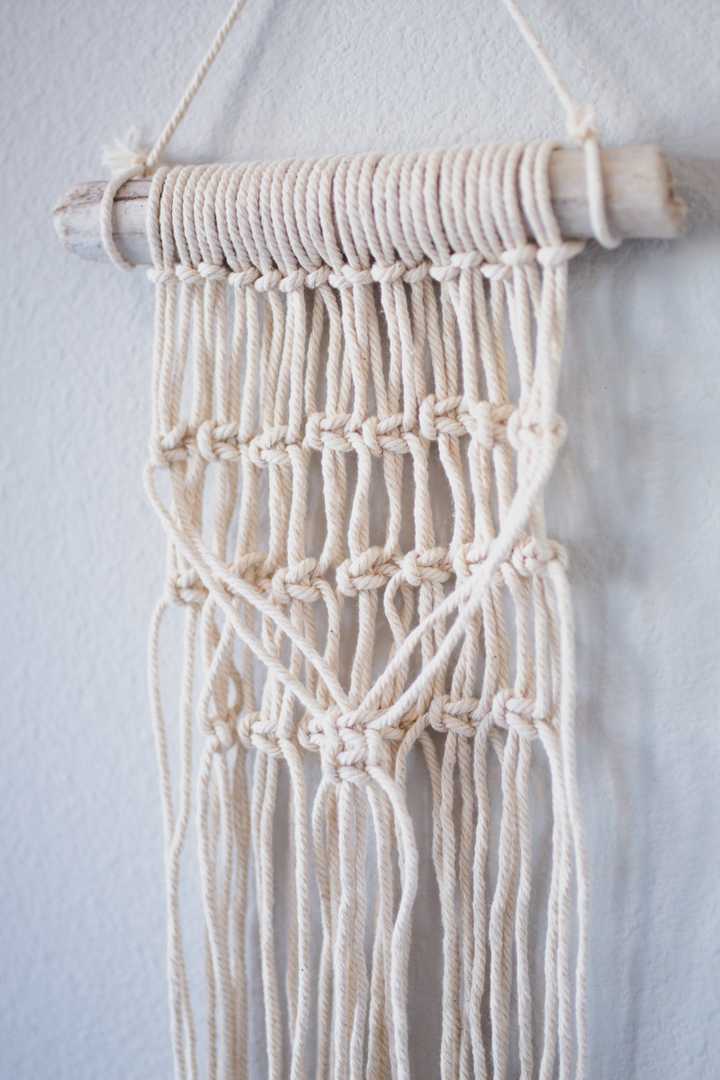 close up of a macrame wall hanging