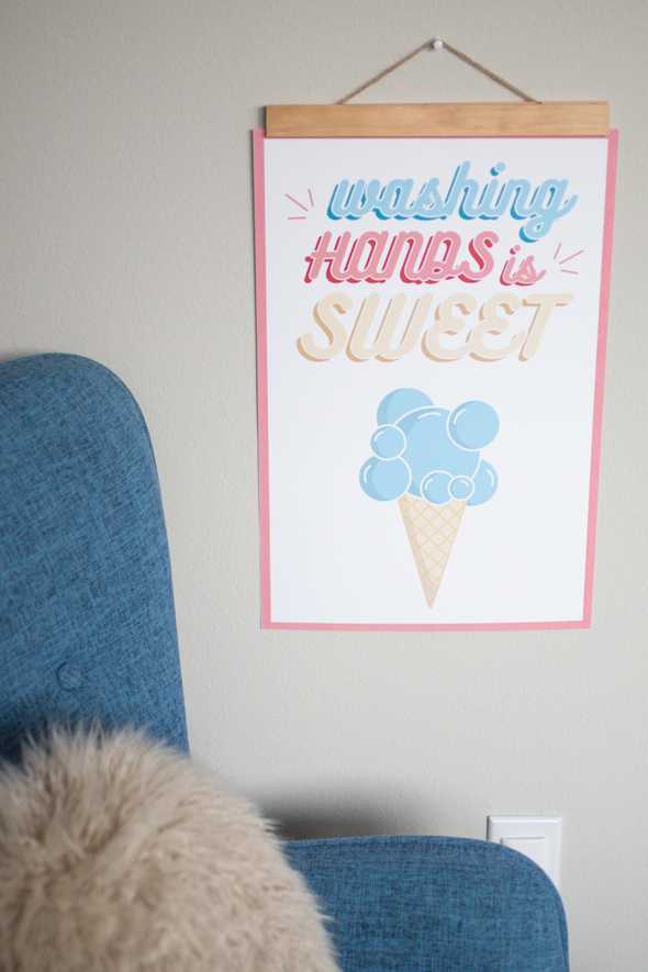 washing hands is sweet poster by a blue chair 